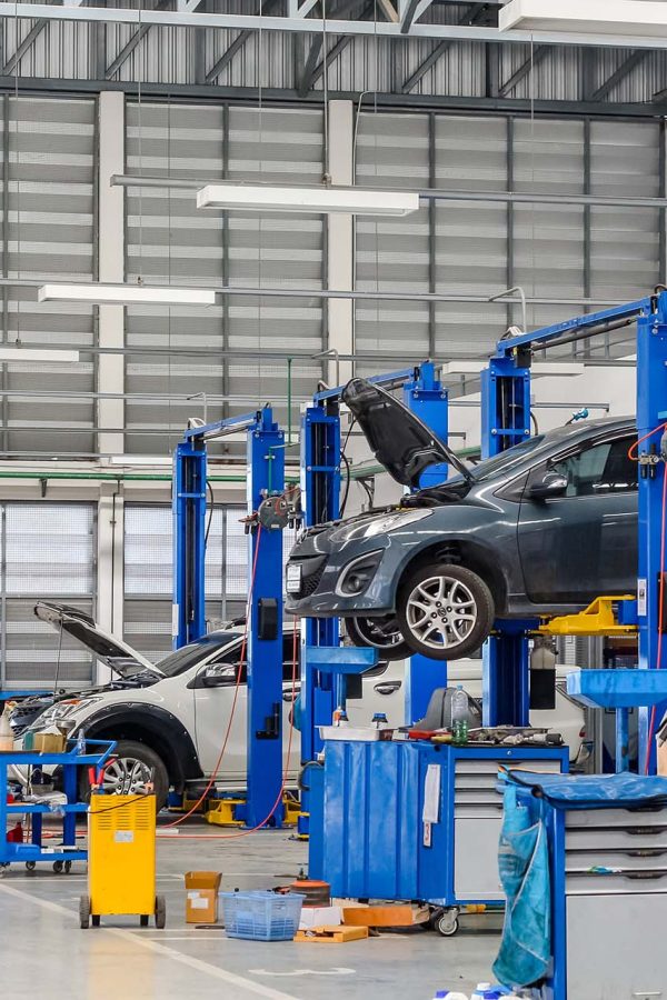 Car in the lifting equipment in the garage being repair and fix